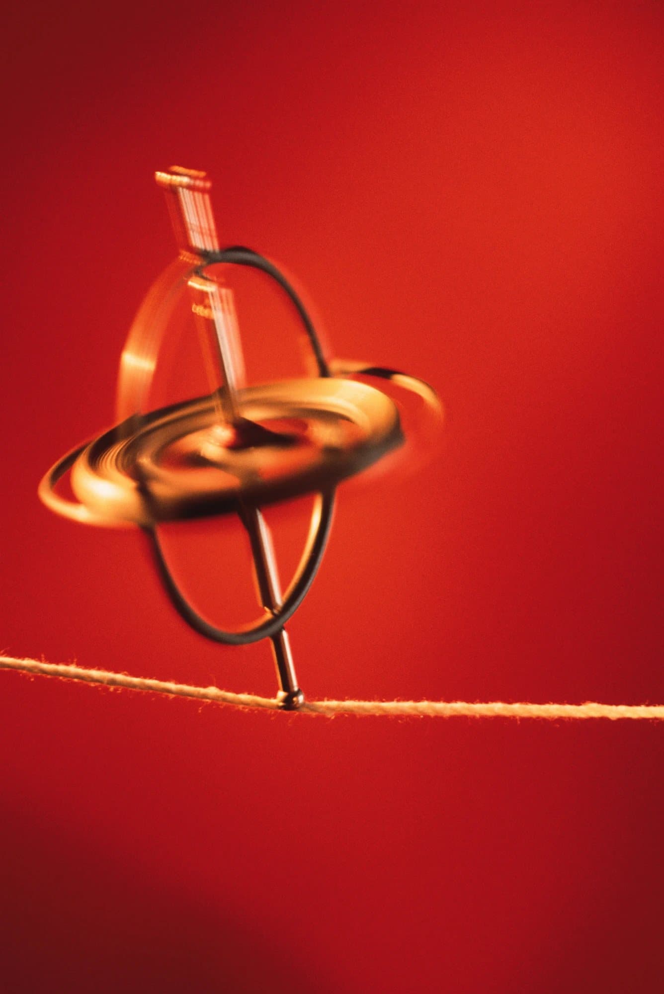 Gyroscope balancing on a taut string